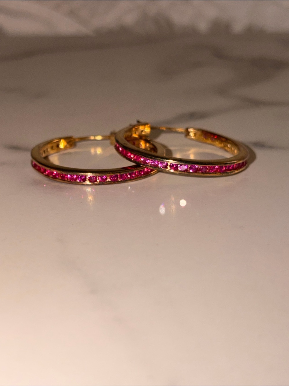 Gold Hoop Earrings with Pink Gem Accents